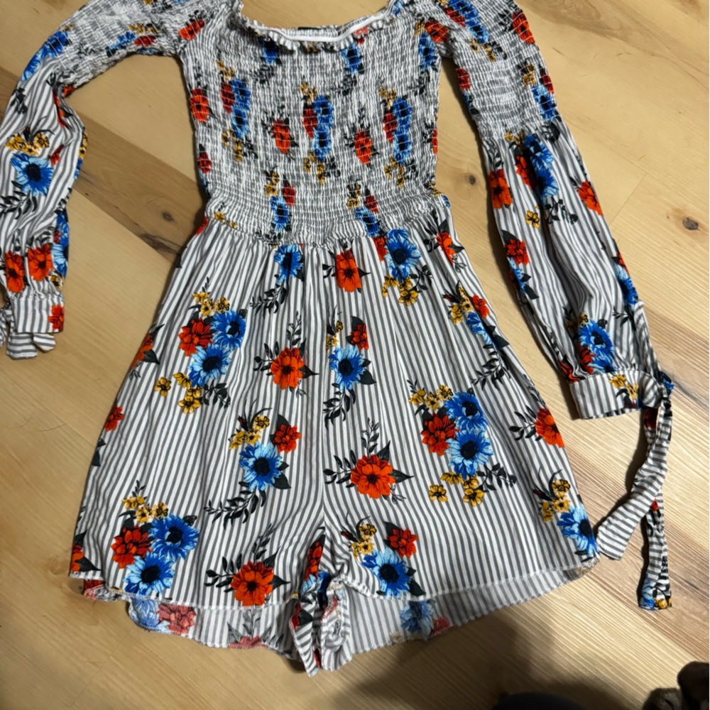 Floral Smocked Long-Sleeve Women’s romper in White with Blue & Red Flowers